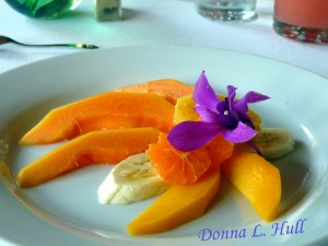 Randy Goff's homemade bread is accompanied by fresh fruit and edible flowers.