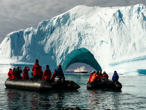 Iceberg hunting in Greenland on a luxury expedition cruise.
