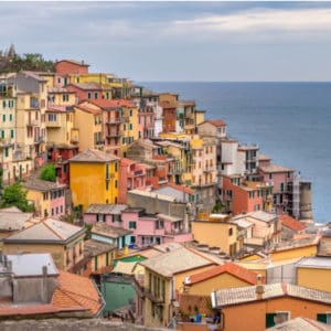 shot of colorful cliff houses overlooking the sea