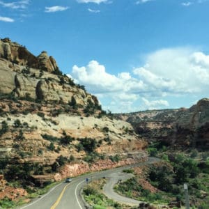 a road passing through large mountainside