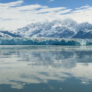 Hubbard glacier reflected in the water with mountains behind
