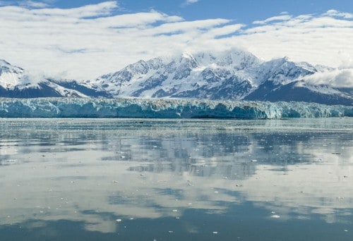 Hubbard glacier reflected in the water with mountains behind