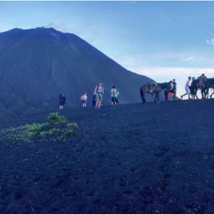 view of people hiking to volcano