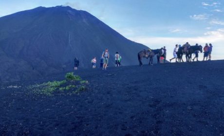 view of people hiking to volcano