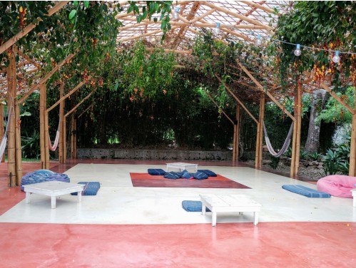 a yoga platform with mats and hammocks