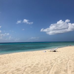 empty beach with one lounge chair