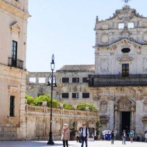 people walking through Italian square