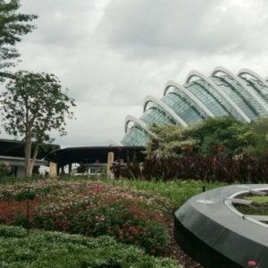 a little pocket park with towering bridge in background.
