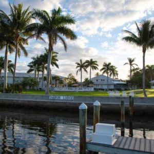 a white building on waters edge