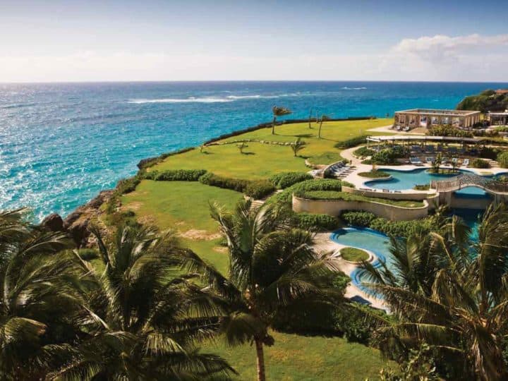 expansive lawn and pool overlooking the Caribbean
