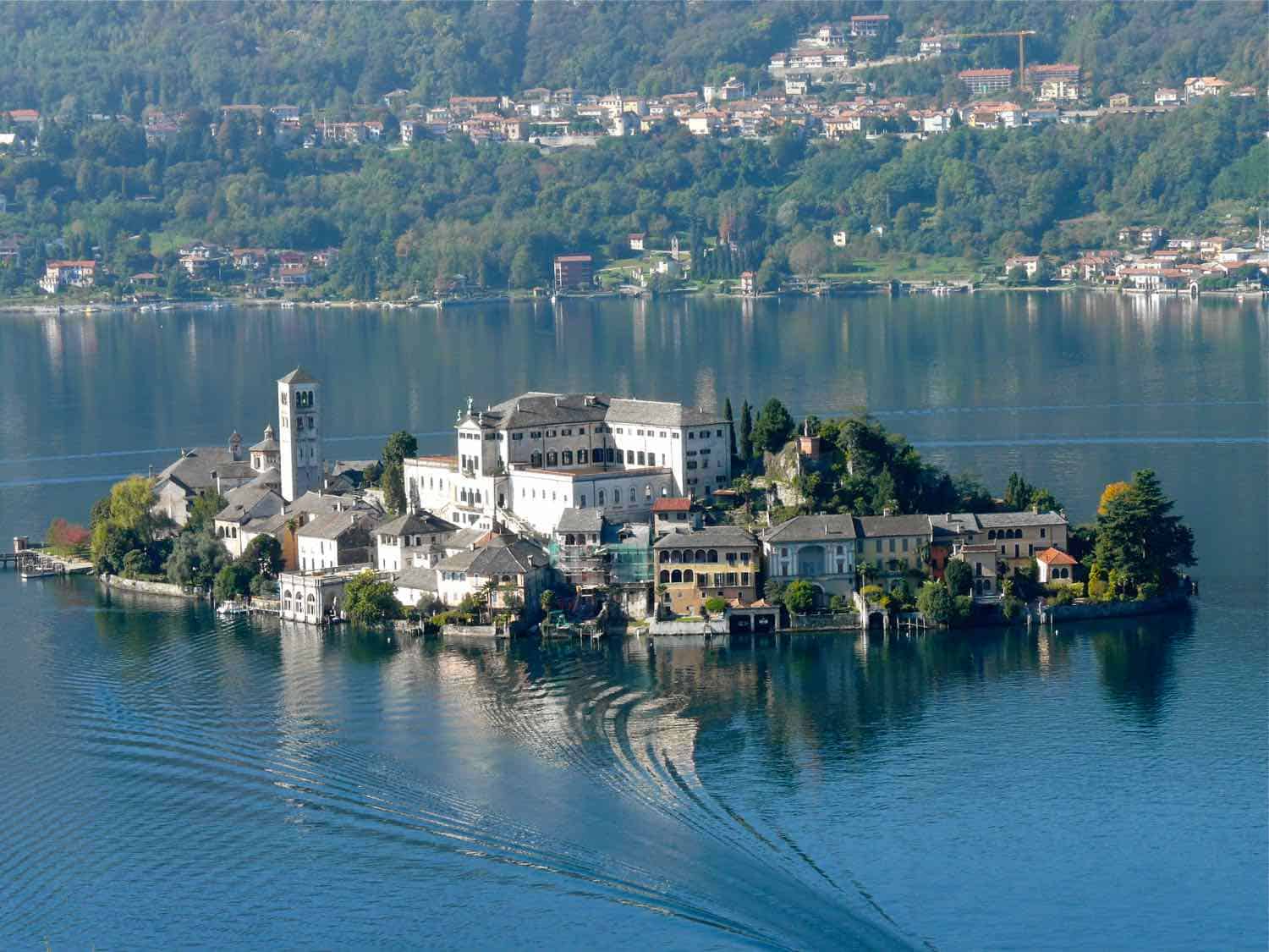 Island with historic buildings in the middle of a lake in Italy