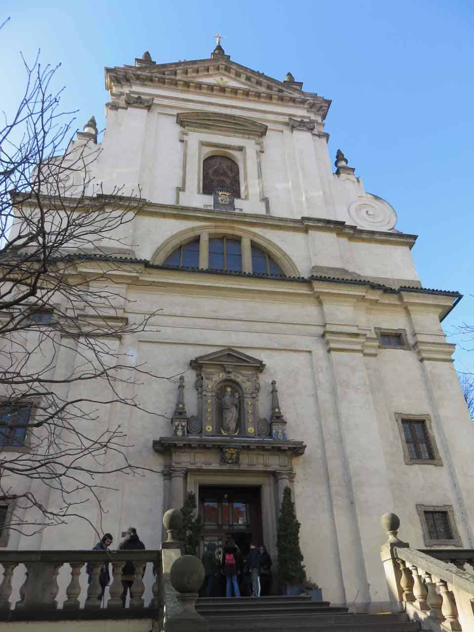 White stone facade of a church in Prague