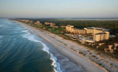 Overhead view of ocean, sand and beach condos at Amelia Island.