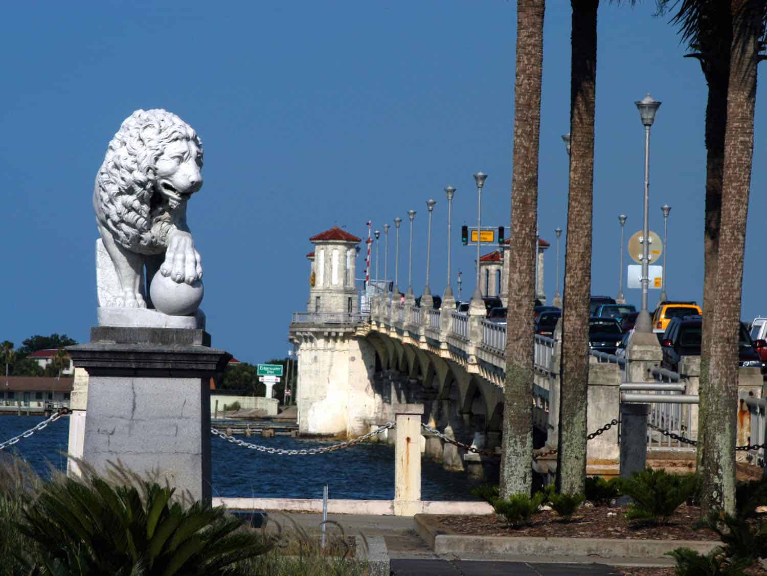 Lion statue next to a bridge