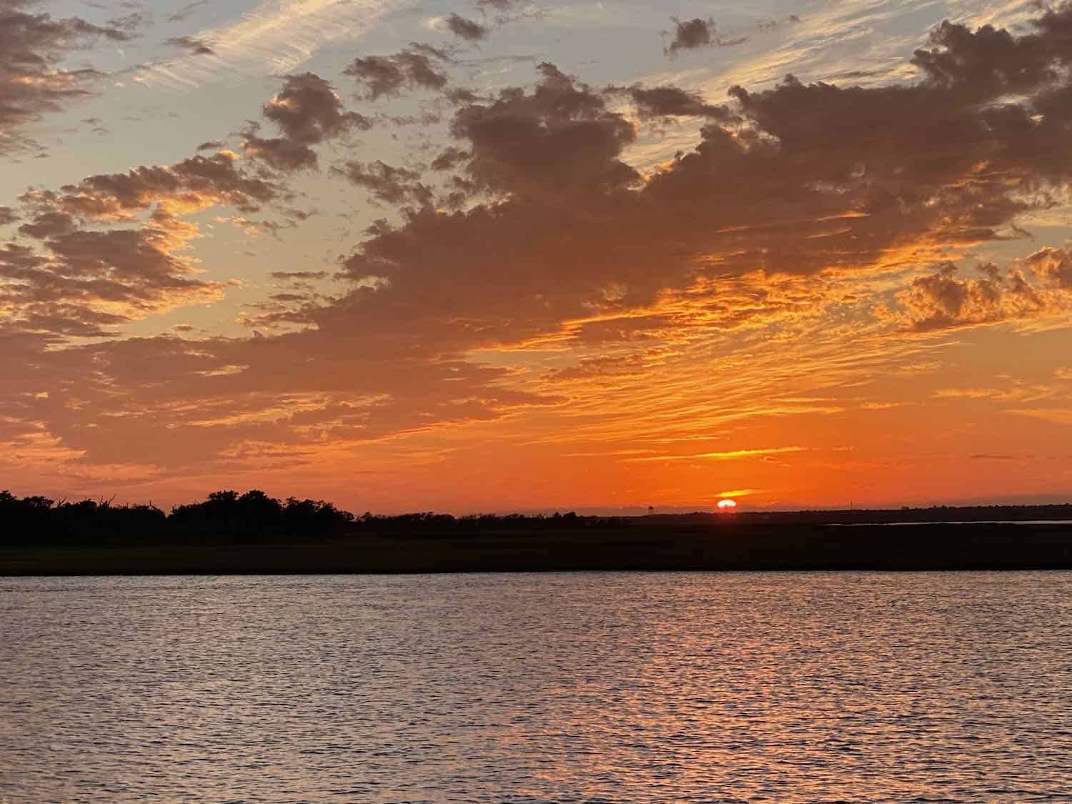 orange sunset over the water on the Onslow County coast of North Carolina.