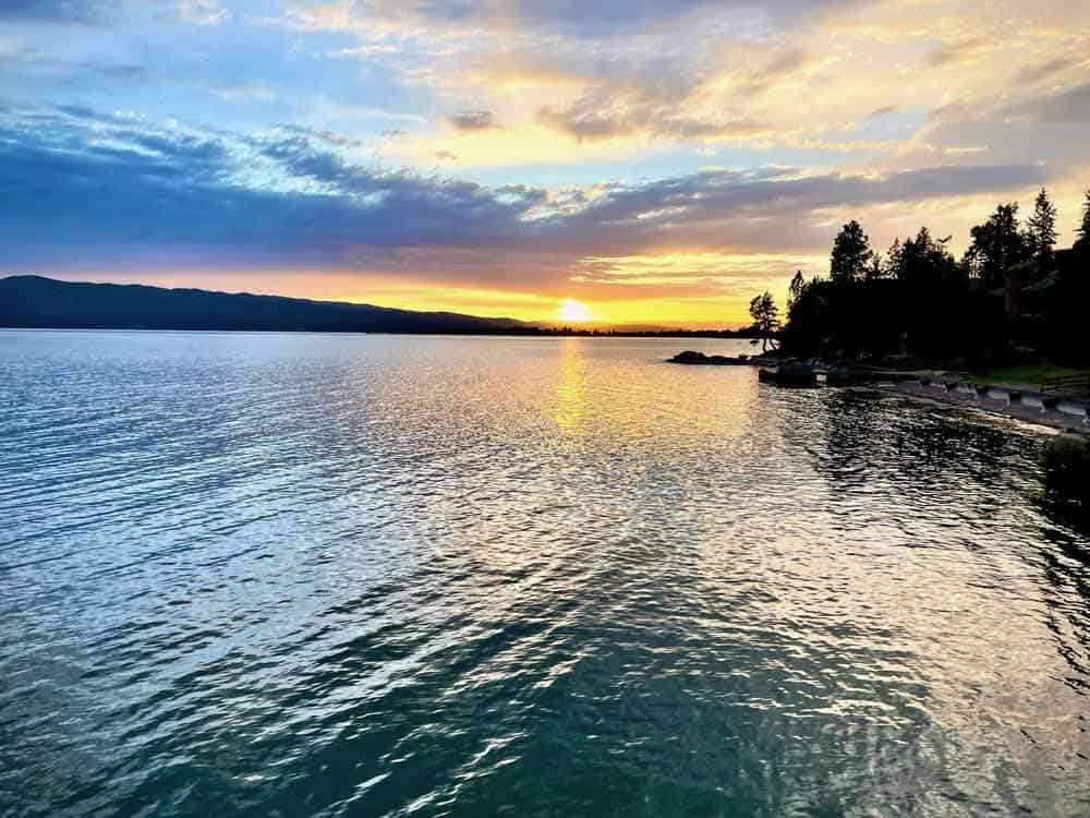 Golden sunset over the silvery waters of Flathead Lake in Montana.