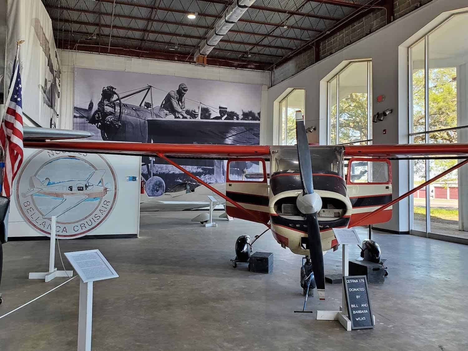 plane with red wings inside the Mississippi Aviation Heritage Museum