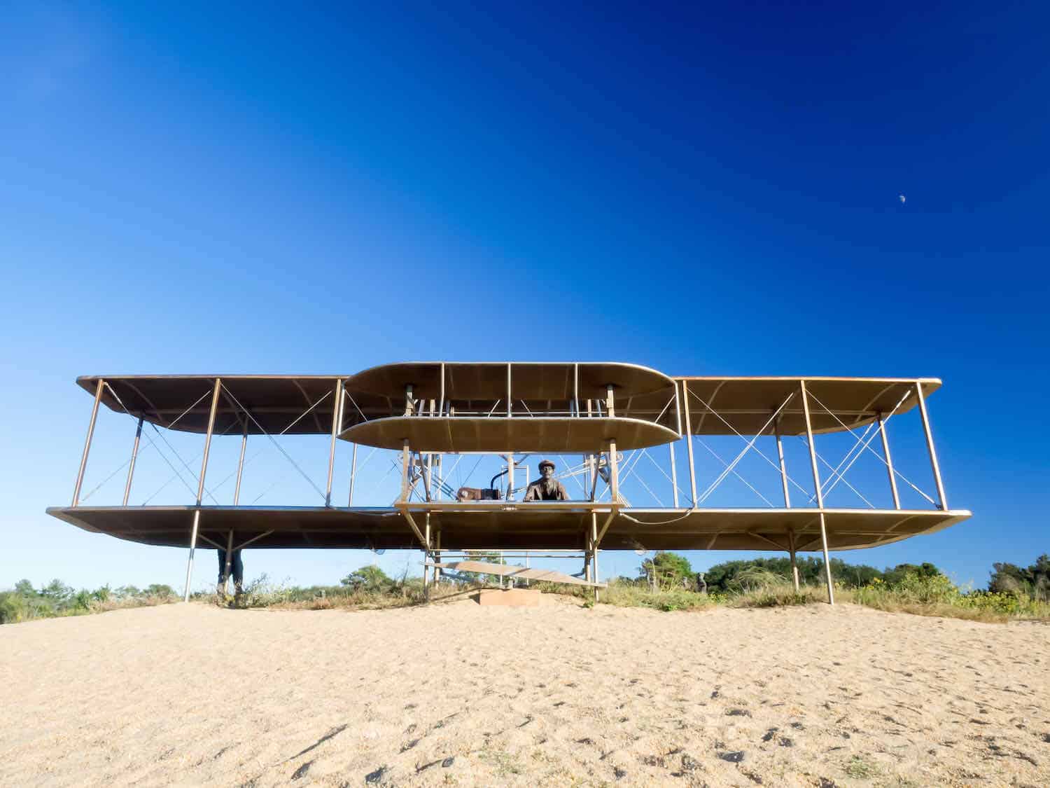 Replica of Wright Brothers plane on top of the dunes at Kill Devil Hill in Kitty Hawk, NC.
