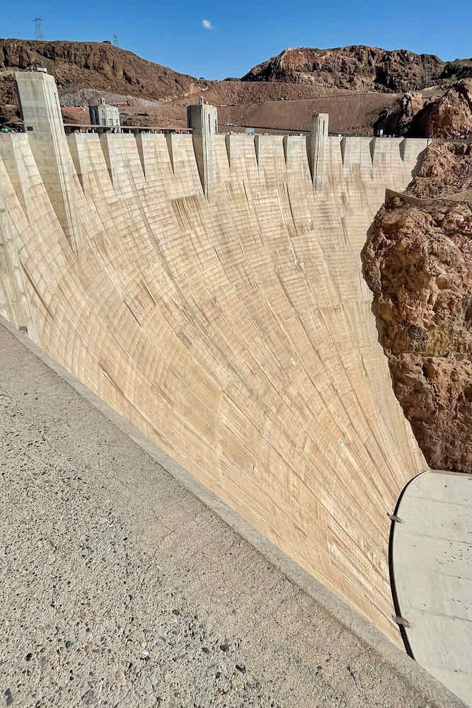 The long slab of concrete of Hoover Dam that reaches down to the Colorado River.