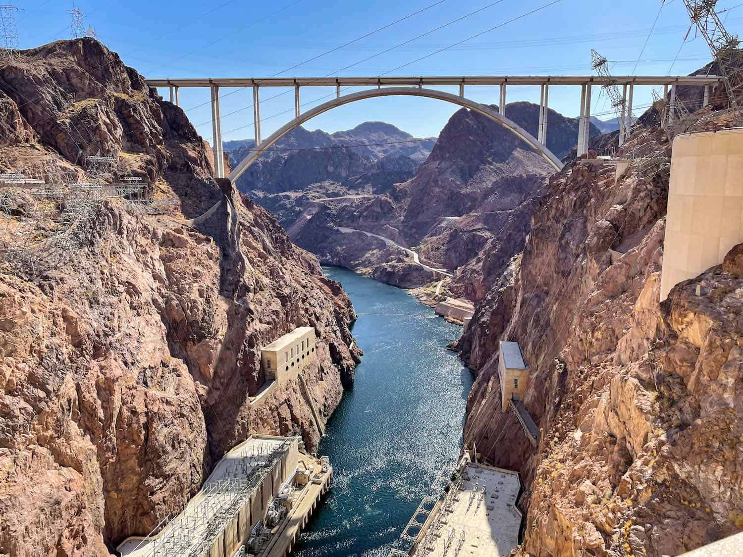 High bridge surrounded by red rock landscape at Hoover Dam. This is an easy day trip from Las Vegas.