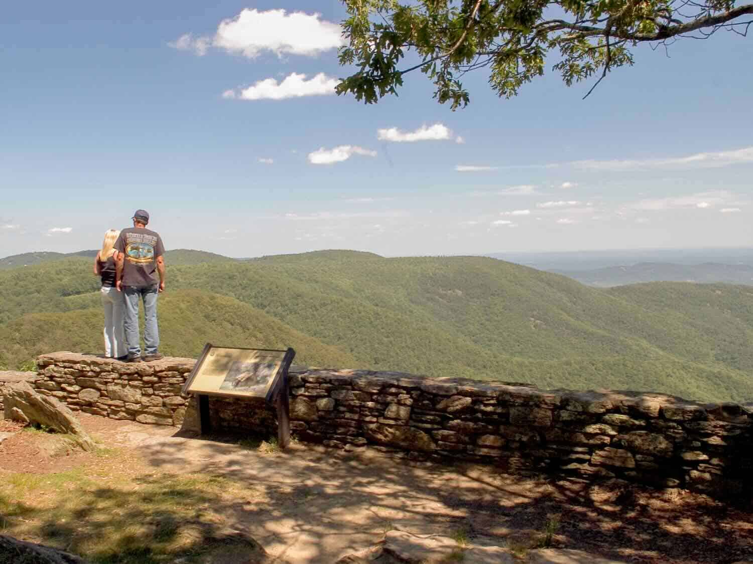 Couple admiring a view in the Blue Ridge Mountains near Boone, NC.